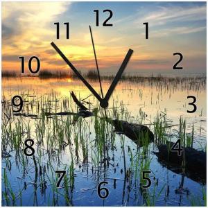 Wallario Wanduhr Schilf am Abend - Sonnenuntergang über der Seelandschaft (Glasuhr)