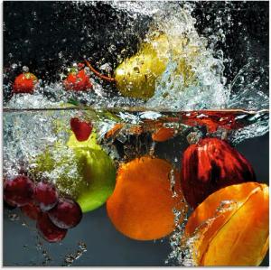 Artland Glasbild Spritzendes Obst auf dem